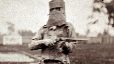 Australia’s most infamous criminal Ned Kelly holds a gun wearing full armour in Melbourne. Kelly’s remains are finally going to be given to his family, 132 years after his execution.