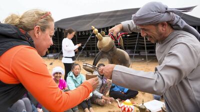 Mona Faraj learns about the art of making gahwa . Courtesy Women’s Heritage Walk