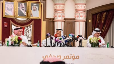 Saudi Aramco chairman Yasir Al Rumayyan, left, with Prince Abdulaziz and Aramco chief executive Amin Nasser, right in Jeddah on Tuesday. Bloomberg