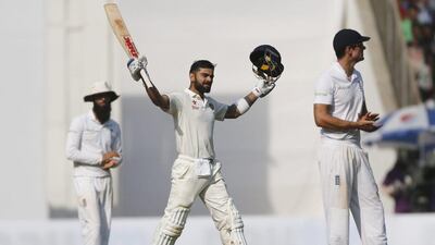 India captain Virat Kohli raises his bat after reaching his century against England on Day 3. Rafiq Maqbool / AP Photo