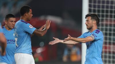 David Silva, right, celebrates after scoring Manchester City's opening goal against West Ham United in Nanjing. Getty