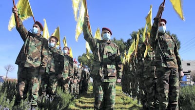 Members of Shiite movement Hezbollah hold a military parade in the town of Riyaq in Lebanon's Bekaa Valley on February 13, 2021, marking the annual anniversary of "martyred " leaders. AFP