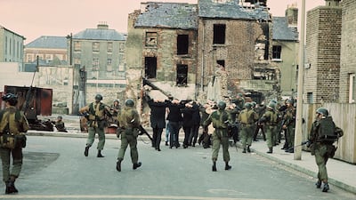 Arrested civilians and British troops during a civil rights demonstration in Derry’s Bogside district in 1972 that became known as Bloody Sunday. Getty Images