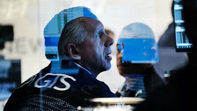 Traders work at the New York Stock Exchange at the start of trading on Monday following Friday's steep decline in global stocks over fears of the new Omicron Covid-19 variant discovered in South Africa. Getty Images / AFP