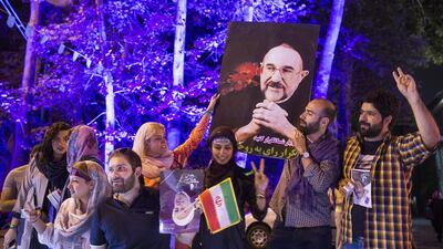 Supporters of Hassan Rouhani celebrate in Tehran after he won the presidential election. Majid Saeedi / Getty Images