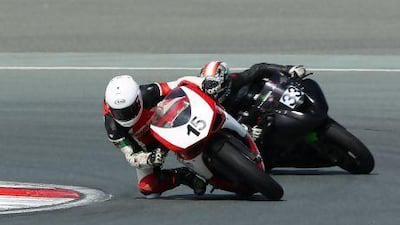 Joe Oxley, left, on his way to his maiden victory in the Motorcity UAE Sportbike Championship race at Dubai Autodrome on Friday. photo courtesy of Dubai Autodrome