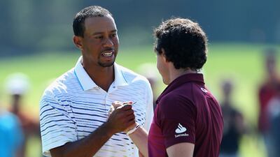 Rory McIlroy congratulates Tiger Woods after their World Golf Final match