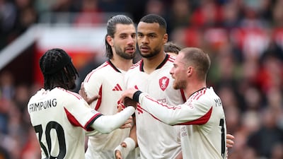 Cody Gakpo with teammates after scoring against Manchester United. Getty Images