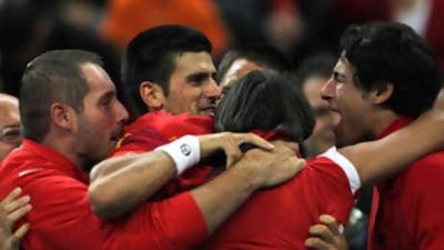 Novak Djokovic, centre, celebrates his win in the Davis Cup for Serbia.