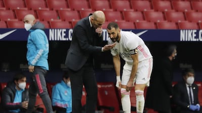 Real Madrid's Karim Benzema with coach Zinedine Zidane. Reuters
