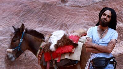 A donkey owner waits for costumers in Petra, where visitor numbers crashed during the Covid-19 pandemic. AFP