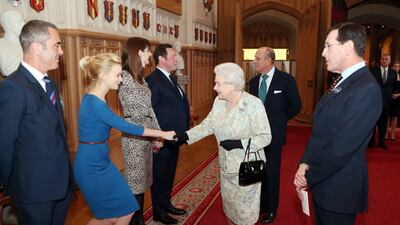 Queen Elizabeth II meets English actress Carey Mulligan at a reception celebrating the British Film Industry, in Windsor Castle, on April 4, 2013. AFP