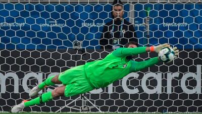 Alisson stops the shot by Gomez. AFP