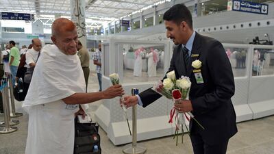 Hajj employees welcome pilgrims at King Abdulaziz International Airport in Jeddah. AFP