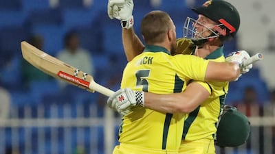 Aaron Finch, left, celebrates his century during Australia's win over Pakistan in the ODI match in Sharjah. AFP