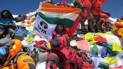 Arunima Sinha poses with the Indian flag on Mount Everest.