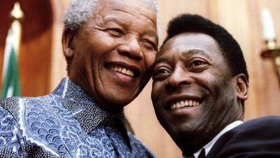 Mandela with Brazilian football legend Pele in 1995. Juda Ngwenya / Getty Images