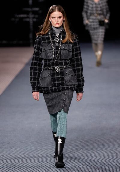 Chanel had a relaxed, outdoorsy feel for autumn/winter 2022, complete with practical pockets and wellington boots. EPA