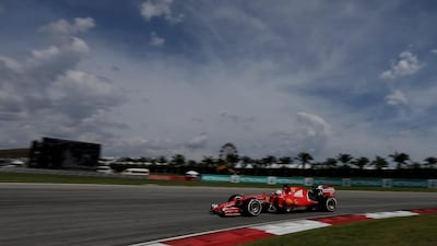 Vettel steers his car on the way to winning the Malaysian Grand Prix at Sepang International Circuit. Andy Wong / AP Photo