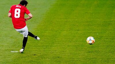 Juan Mata scores from the penalty spot against Kristiansund. EPA