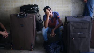 A Palestinian man rests as he waits with his family for a travel permit to cross into Egypt through the Rafah border crossing after it was opened by Egyptian authorities for humanitarian cases, in Rafah in the southern Gaza Strip August 16, 2017. Ibraheem Abu Mustafa / Reuters
