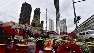 A makeshift memorial for the victims of the Christmas market attack in Berlin on December 24, 2016. A 20-year-old Syrian asylum-seeker went on trial on January 4, 2017, accused of reconnoitering potential sites in Berlin for ISIL attacks. John MacDougall / AFP