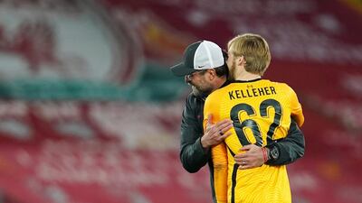 Liverpool manager Jurgen Klopp embraces Caoimhin Kelleher after the win over Ajax. EPA