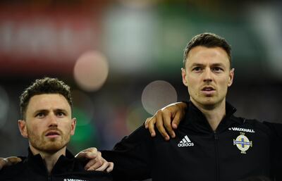 Brothers Corry Evans and Jonny Evans before the match in Belfast. Clodagh Kilcoyne / Reuters