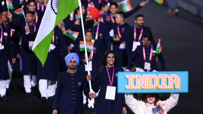 Manpreet Singh and PV Sindhu, flag bearers for India, lead their team out. Getty