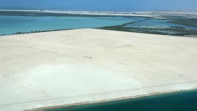 Aldar said that 47 studio apartments measuring between 50 and 60 square metres would go on sale for around Dh810,000, equating to around Dh16,000 per square metre. Above, a aerial view of the Yas Island site. Pawan Singh / The National