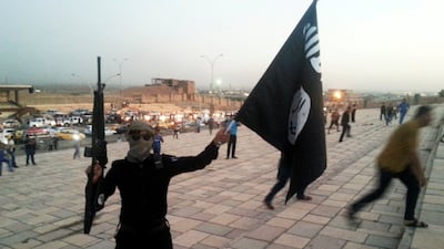 An ISIS fighter in Mosul in June 2014, after the militant group had taken control of the northern Iraqi city. Reuters