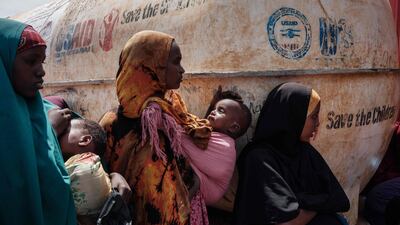 Mothers wait for food and health services in a camp for internally displaced persons in Baidoa, Somalia, on February 14, 2022. Insufficient rainfall since late 2020 has come as a fatal blow to populations already suffering from a locust invasion between 2019 and 2021 and the Covid-19 pandemic. AFP