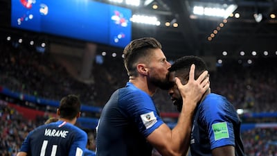 France's Samuel Umtiti celebrates with teammate Olivier Giroud after scoring his team's first goal. Getty Images