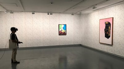 A visitor trying on the VR headset for Shezad Dawood’s Encroachments (2019).