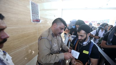 Iranian Shiite pilgrims cross the border into Iraq as they head to Karbala to attend Arbaeen. EPA