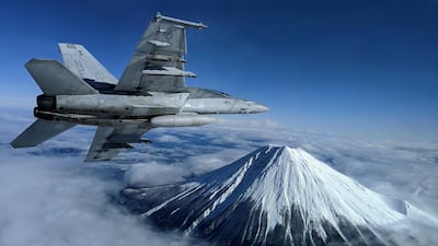 A US Navy F/A-18F Super Hornet flies past Mount Fuji, Japan. Reuters