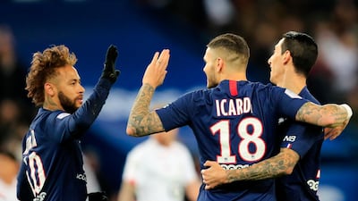 PSG's Mauro Icardi, centre, celebrates with teammates Neymar and Angel Di Maria after scoring the opening goal against Lille. AP