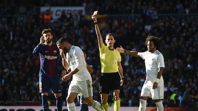 MADRID, SPAIN - DECEMBER 23: Daniel Carvajal of Real Madrid is shown a red card by referee Jose Maria Sanchez during the La Liga match between Real Madrid and Barcelona at Estadio Santiago Bernabeu on December 23, 2017 in Madrid, Spain. (Photo by Denis Doyle/Getty Images)
