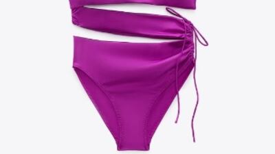 The rich and luxurious magenta colour will make you stand out at any pool or beach get-together in this Zara one-piece that features midriff cut-outs and a side tie; Dh219, zara.com. Photo: Zara