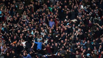 West Ham fans celebrate as Dimitri Payet of West Ham United scores their first goal from a free kick during the FA Cup sixth round match between Manchester United and West Ham United at Old Trafford on March 13, 2016 in Manchester, England. (Photo by Michael Regan/Getty Images)