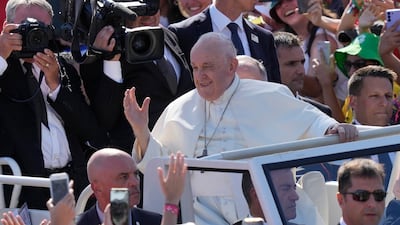Pope Francis waves at a gathering of young people in Eduardo VII Park in Lisbon. AP