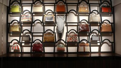 A wall is covered in iconic Kelly bags, an homage the brand’s female customers. All, however, is not as it seems. The horse’s head in the centre, when no one is looking, playfully pokes its tongue out. Pawan Singh / The National