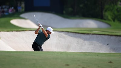 Francesco Molinari hits his second shot on the 16th hole during the second round of the DP World Tour Championship. Ross Kinnaird / Getty Images