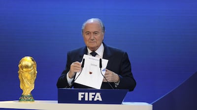 Then Fifa president Sepp Blatter declares Qatar the host of the 2022 World Cup. Philippe Desmazes / AFP