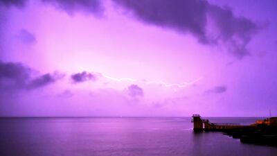 A thunder lightning storm over Blackrock diving tower at Salthill beach brings torrential rain after a heatwave, in Galway, Ireland. Reuters