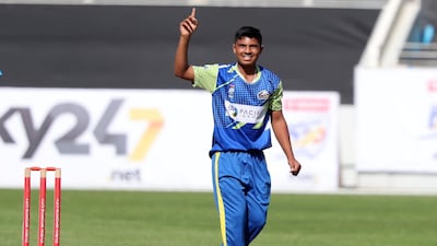 Fujairah's Aayan Afzal Khan after taking the wicket of Dubai's Ronak Panoly in the Emirates D20. Chris Whiteoak / The National
