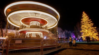 A picture made with a slow shutter speed shows a carousel being installed in downtown during Christmas preparations in Chisinau, Moldova. Dumitru Doru / EPA