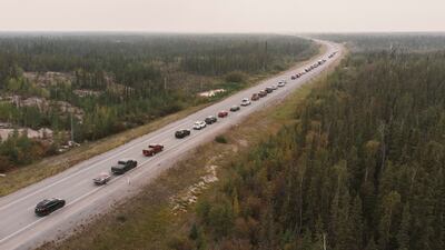 Residents leave Yellowknife following an evacuation order, as a wildfire approached the city in Northwest Territories, Canada. Reuters