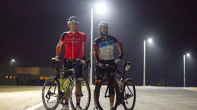 Peter Manson (left) and Sherif Said (right), members of the Al Raha Cycling group at Al Hudayriyat Island. Khushnum Bhandari for The National