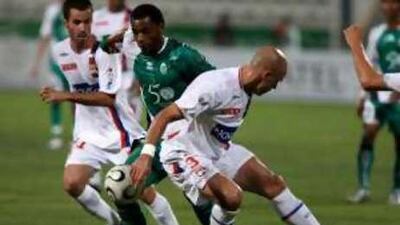 Salem Saad, centre, in action during a friendly against the French team Lyon. Saad suffered a suspected heart attack last November during a training session with his club.